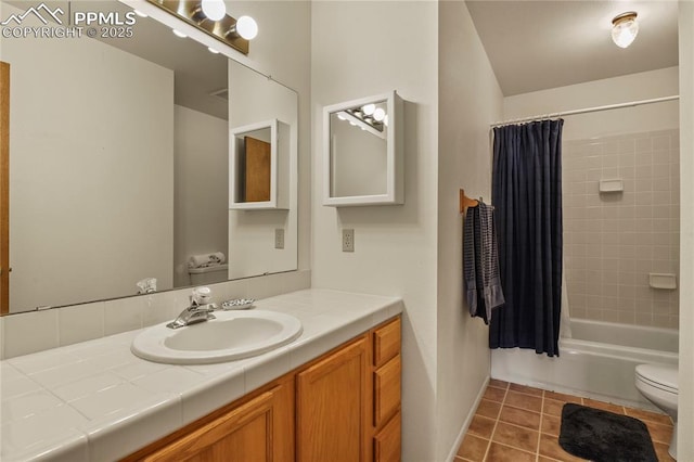 full bathroom with shower / bathtub combination with curtain, vanity, tile patterned flooring, and toilet