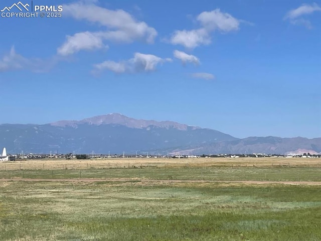 mountain view featuring a rural view