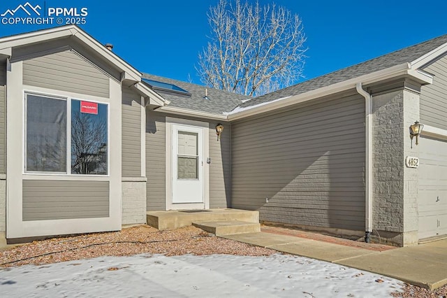 entrance to property with a garage