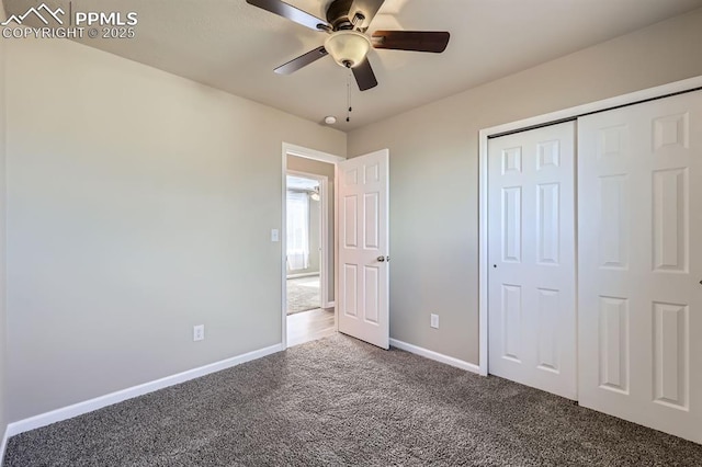 unfurnished bedroom featuring carpet, ceiling fan, and a closet