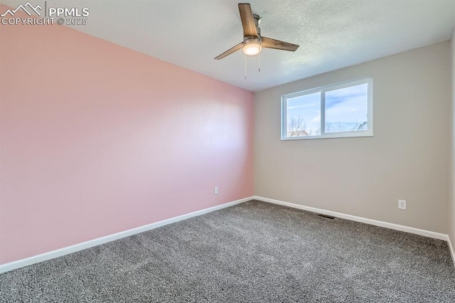 carpeted empty room with a textured ceiling and ceiling fan