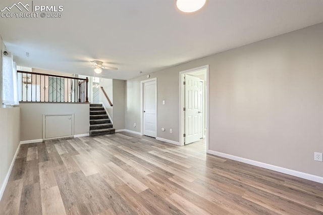 empty room featuring light hardwood / wood-style floors and ceiling fan