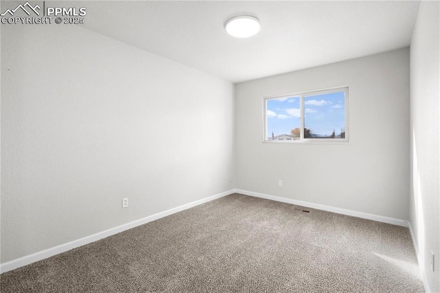 unfurnished room with carpet flooring