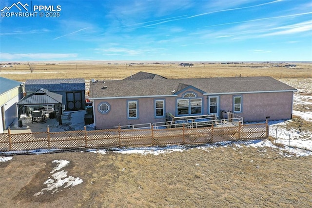 ranch-style home with a rural view and a gazebo