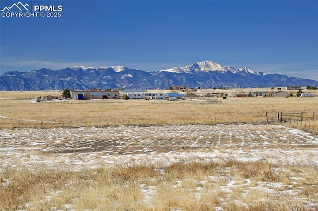 view of mountain feature with a rural view