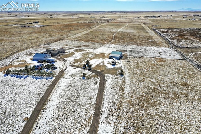 birds eye view of property with a rural view