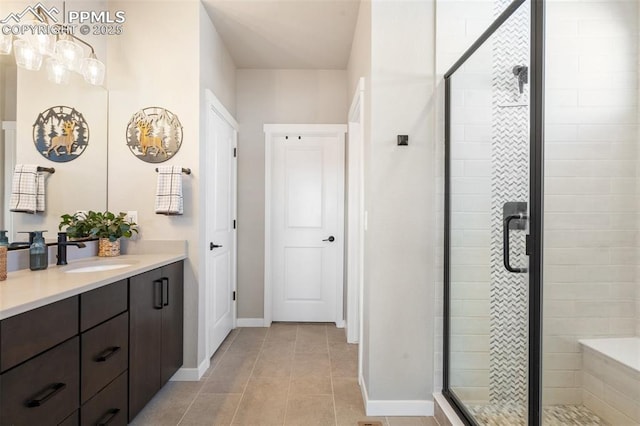 bathroom with tile patterned floors, vanity, and an enclosed shower