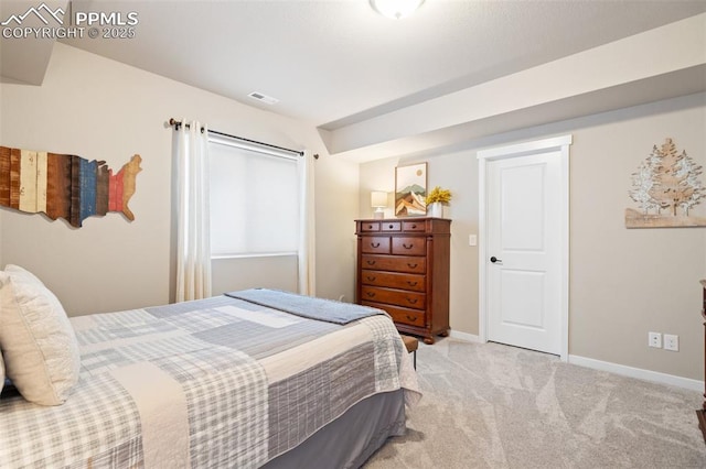 bedroom featuring light carpet