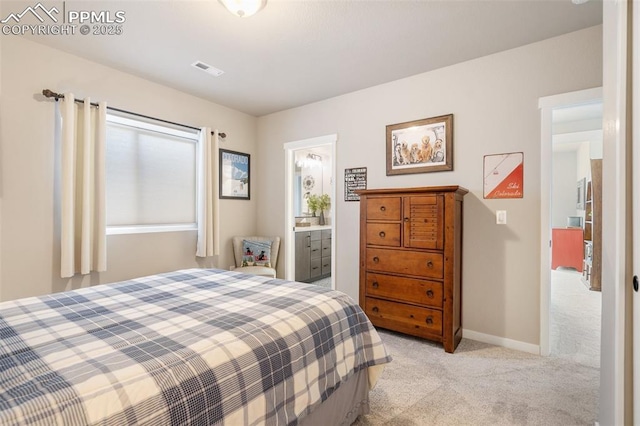 carpeted bedroom with ensuite bathroom