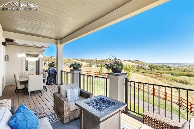 balcony featuring a fire pit