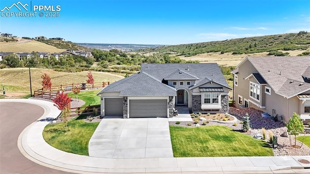 view of front of property with a garage and a front yard