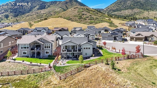 drone / aerial view featuring a mountain view