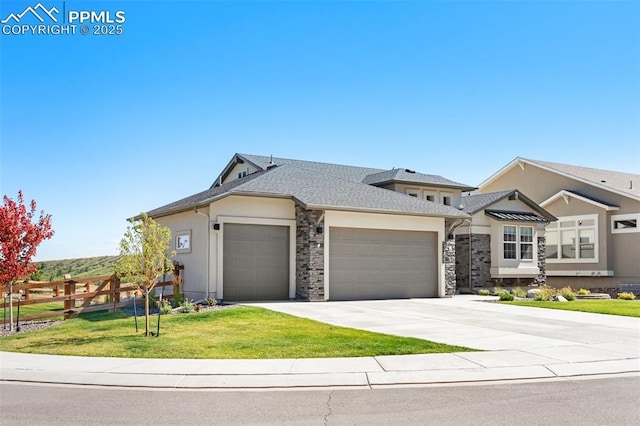 view of front of home featuring a garage and a front lawn