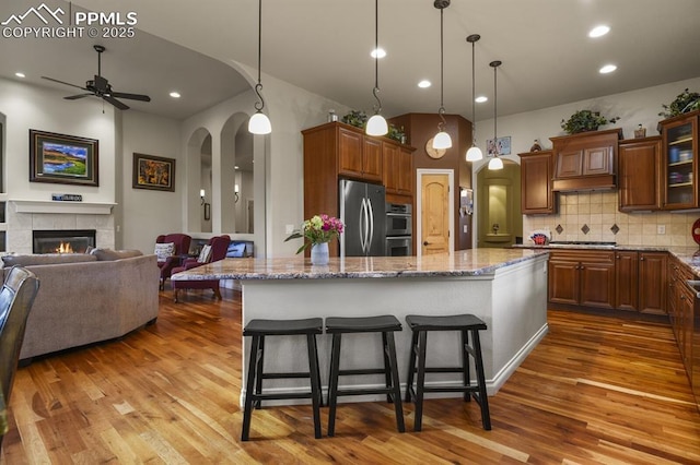 kitchen featuring a breakfast bar area, a center island, and appliances with stainless steel finishes