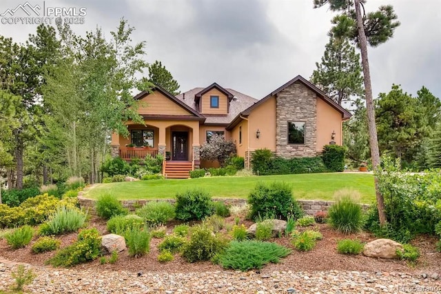 craftsman house featuring a front yard and a porch