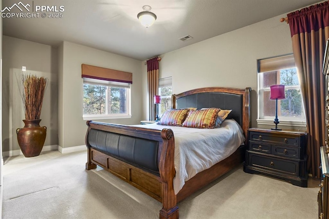 bedroom with light colored carpet