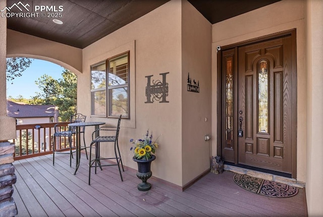 property entrance featuring covered porch