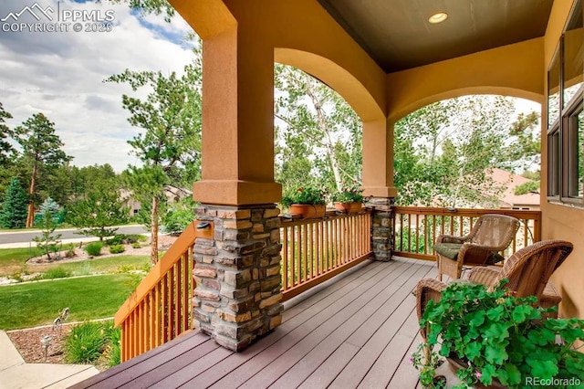 wooden terrace with a porch