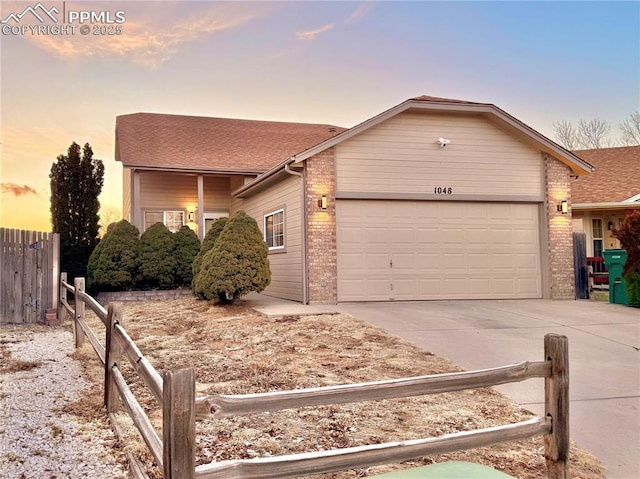 ranch-style home featuring a garage