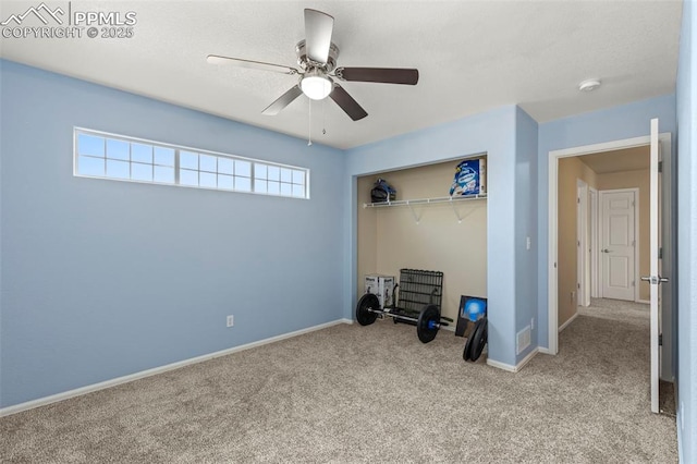 carpeted bedroom with ceiling fan and a closet