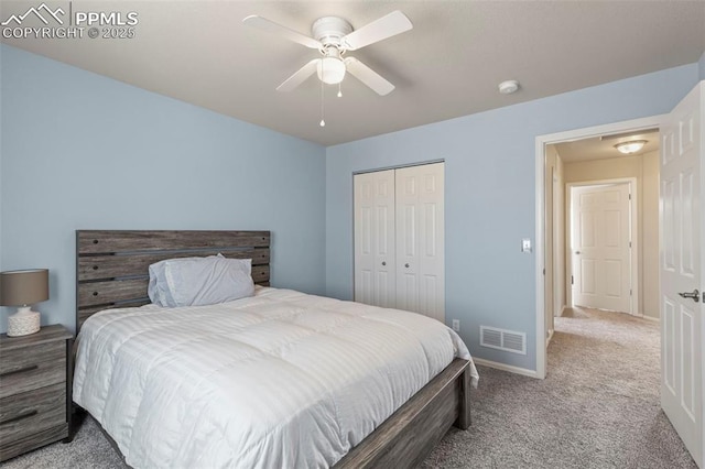 bedroom with ceiling fan, light colored carpet, and a closet