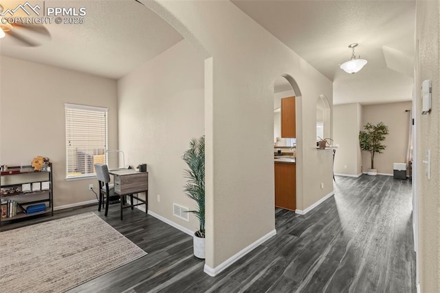 hallway with dark hardwood / wood-style floors