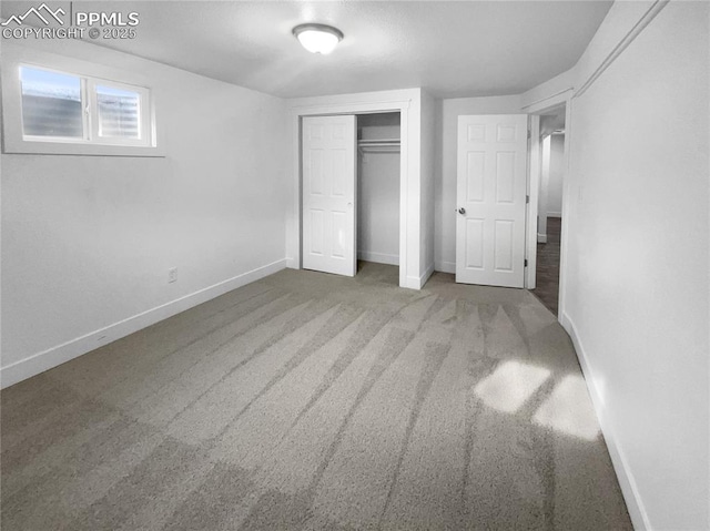 unfurnished bedroom with carpet floors and a closet