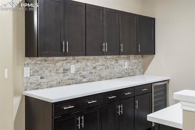 kitchen featuring backsplash and beverage cooler