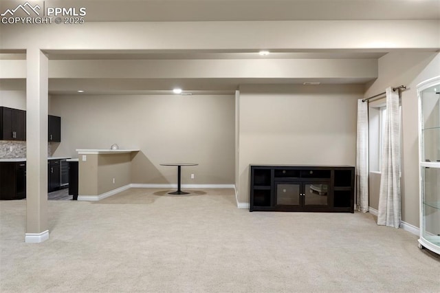 basement featuring light carpet