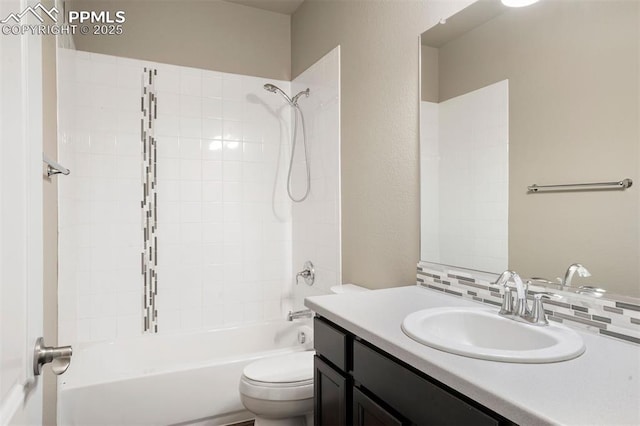 full bathroom with vanity, toilet, washtub / shower combination, and decorative backsplash