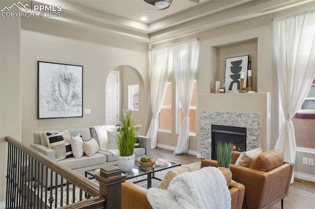 living room featuring a fireplace and light hardwood / wood-style flooring