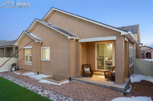 rear view of property featuring a patio