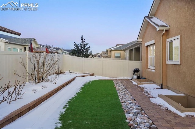 view of yard covered in snow