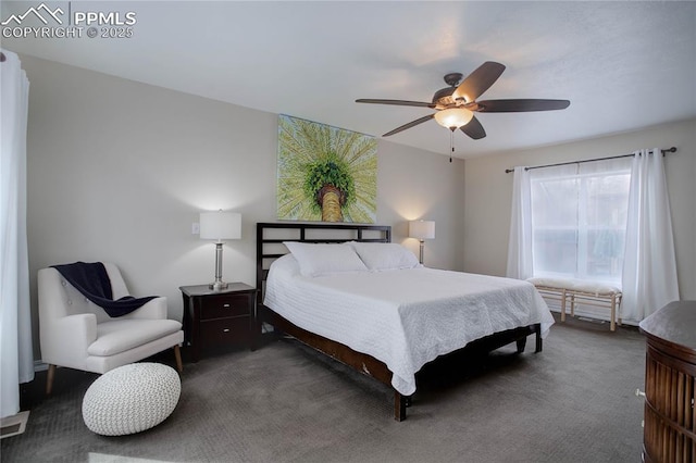 bedroom with dark colored carpet and ceiling fan