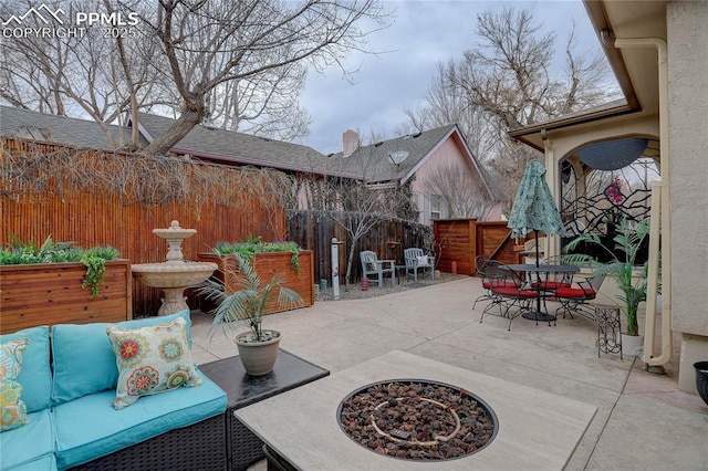 view of patio / terrace with outdoor dining space and a fenced backyard