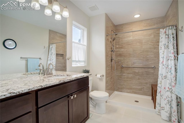 full bath featuring visible vents, toilet, a tile shower, vanity, and tile patterned floors