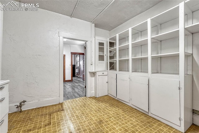 interior space featuring white cabinets