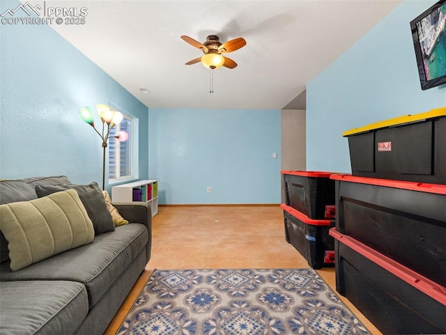 carpeted living room with ceiling fan