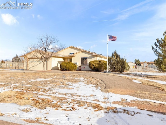 view of front of property with a garage