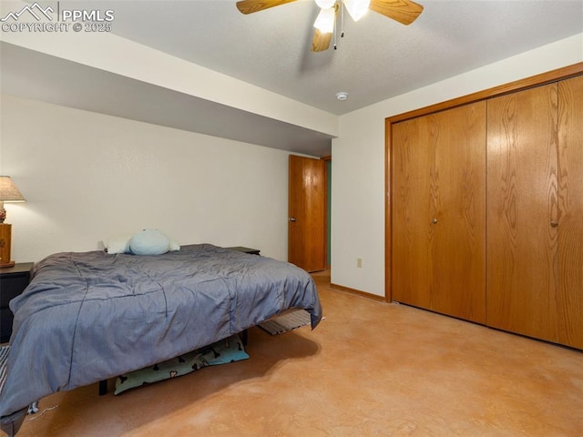 bedroom featuring light carpet, ceiling fan, and a closet