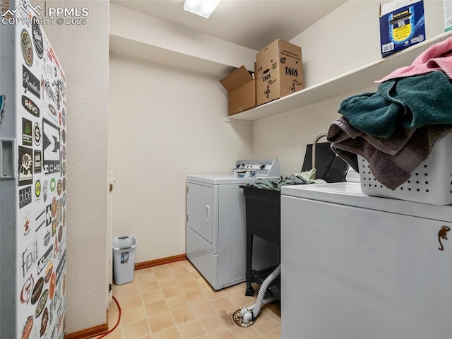 washroom with independent washer and dryer