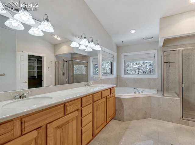 bathroom featuring vanity, separate shower and tub, and vaulted ceiling