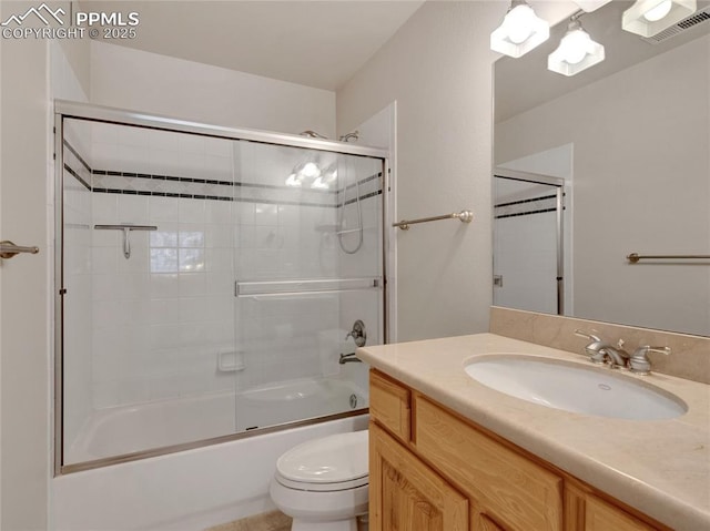 full bathroom featuring vanity, toilet, and enclosed tub / shower combo