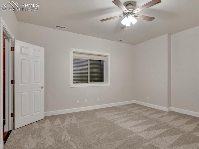 carpeted empty room with ceiling fan