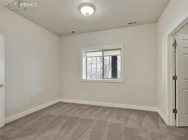 empty room featuring carpet floors