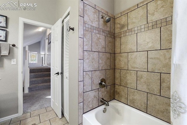 bathroom featuring tile patterned flooring and shower / tub combo with curtain