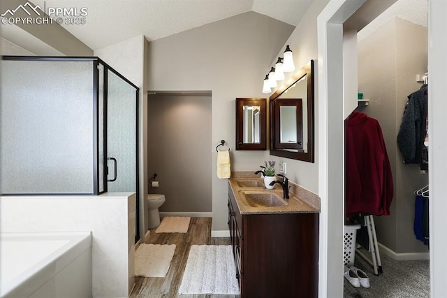 full bathroom with lofted ceiling, toilet, separate shower and tub, vanity, and hardwood / wood-style flooring