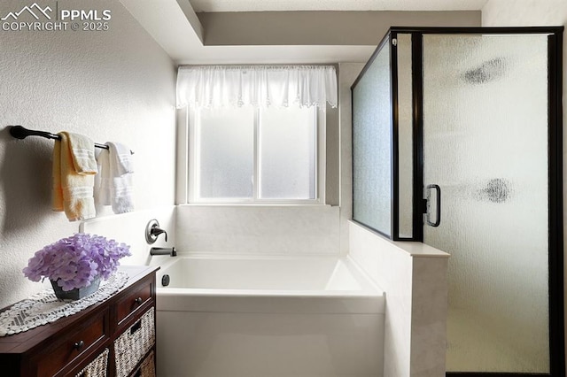 bathroom featuring separate shower and tub