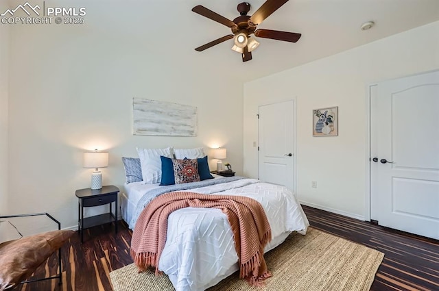 bedroom featuring dark wood-type flooring and ceiling fan