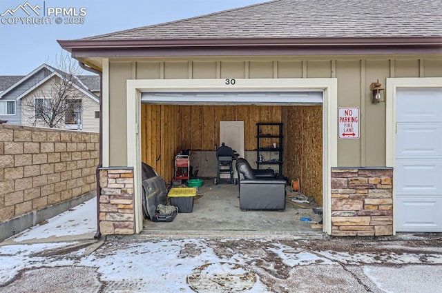 view of snow covered garage